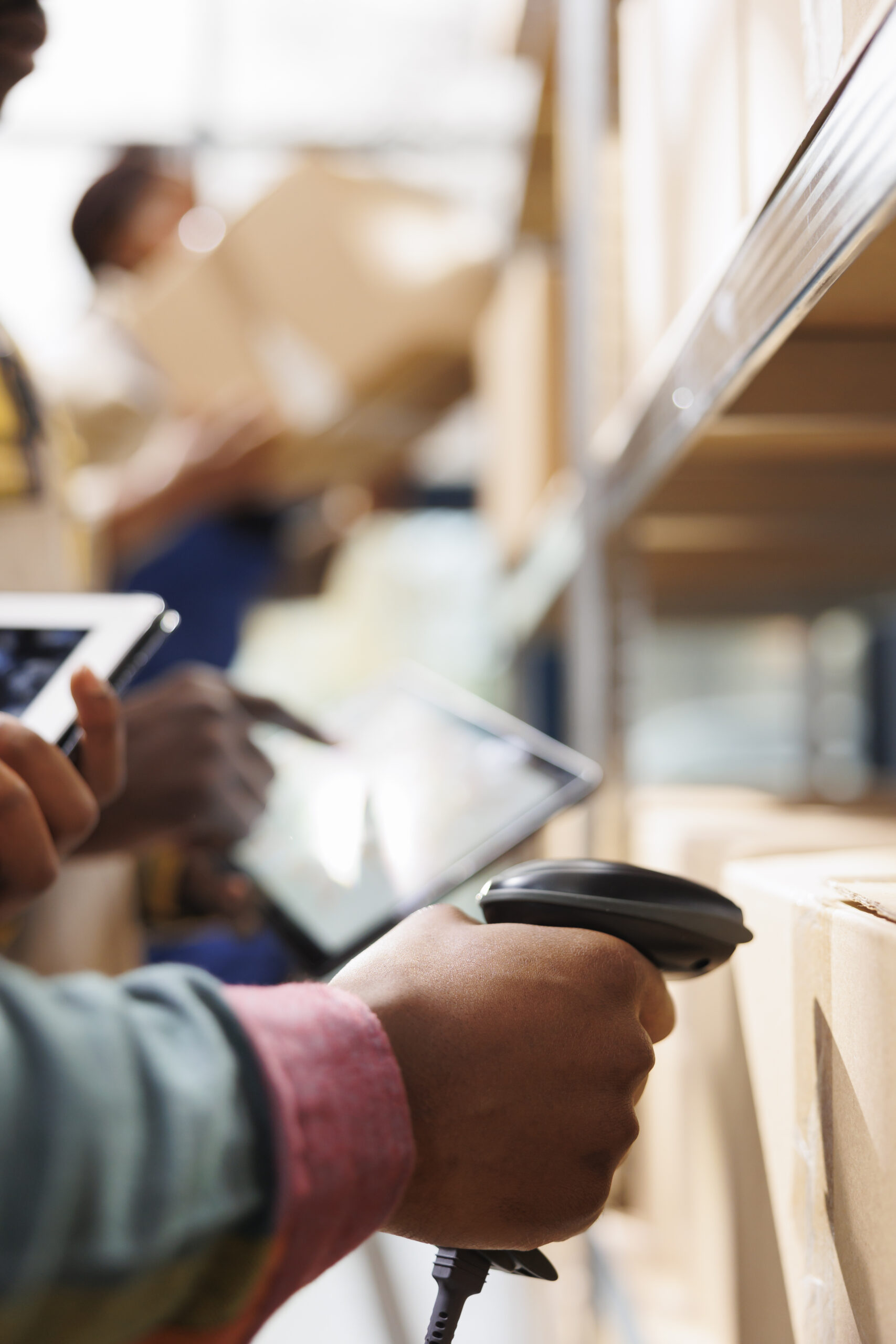 a person using a scanner to scan a product